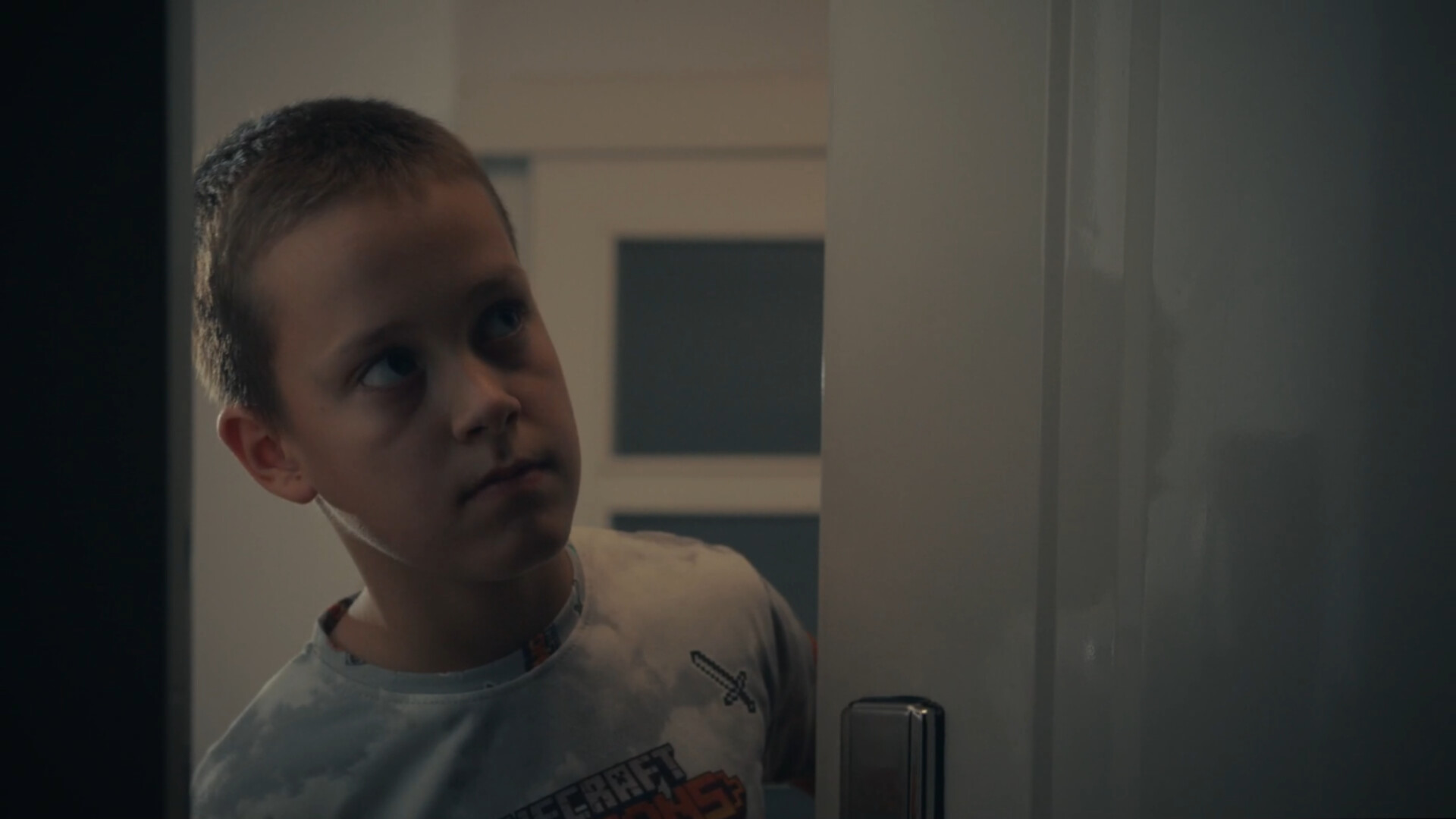 A Boy Opens the Door